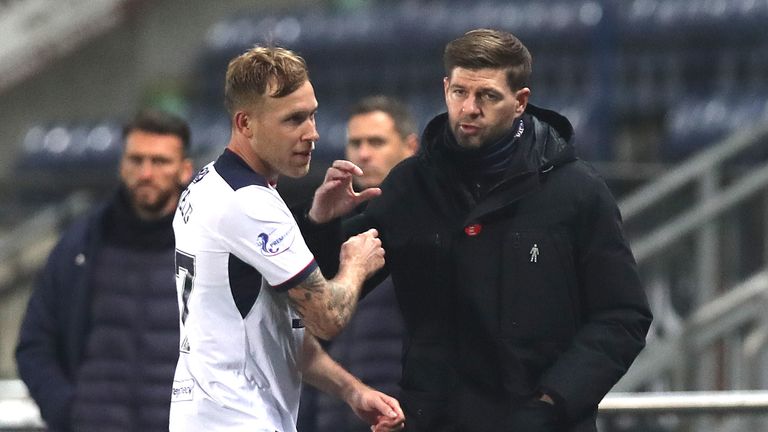 Steven Gerrard embraces Scott Arfield after the player is substituted during Rangers' win at Falkirk