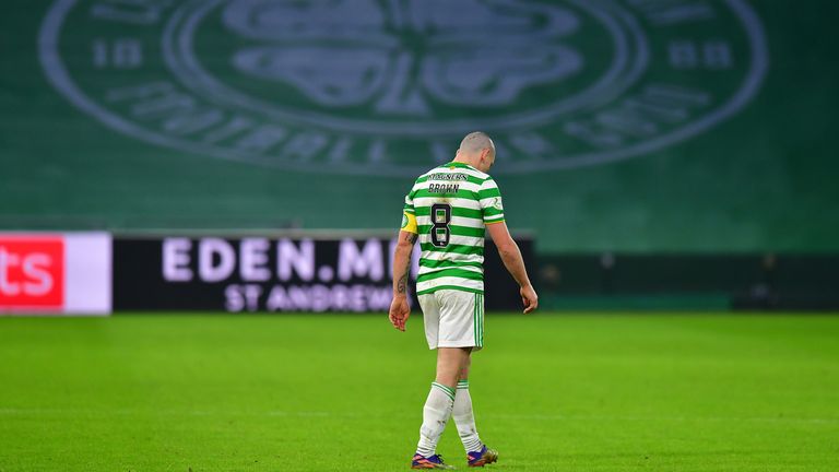 A dejected Scott Brown leaves the pitch after Celtic's defeat to Ross County