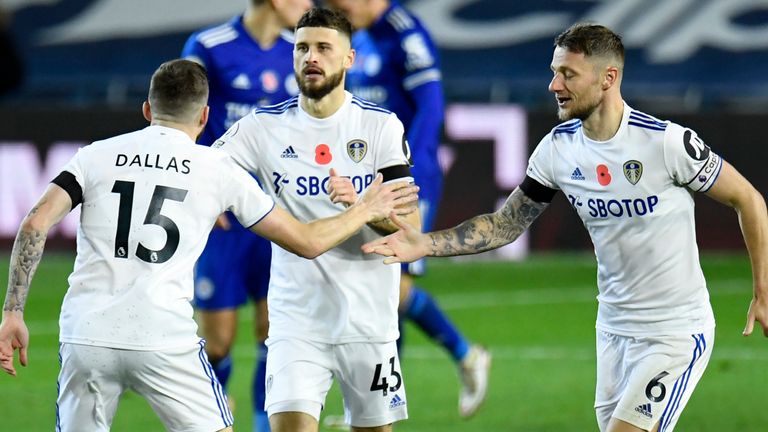 Stuart Dallas is congratulated after pulling a goal back for Leeds United against Leicester City