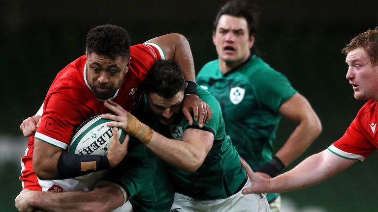 Faletau is tackled by Robbie Henshaw 