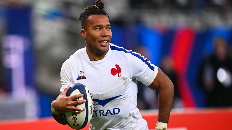 Teddy Thomas races in to score a try for France