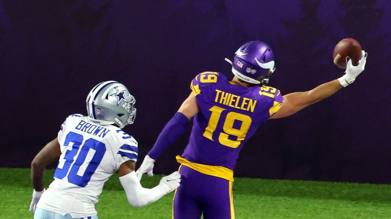 Adam Thielen #19 of the Minnesota Vikings catches a touchdown pass against Anthony Brown #30 of the Dallas Cowboys in the third quarter during their game at U.S. Bank Stadium