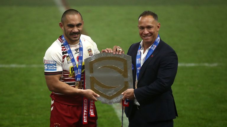 Wigan Warriors coach Adrian Lam (R) and Thomas Leuluai poses with the 2020 League Leaders Shield