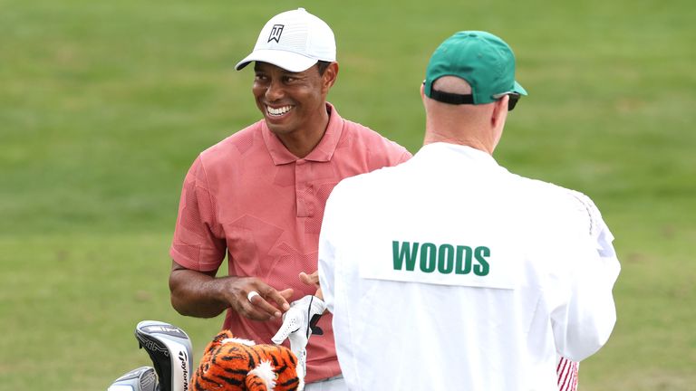 Tiger Woods warms up on the range during a practice round prior to the Masters 