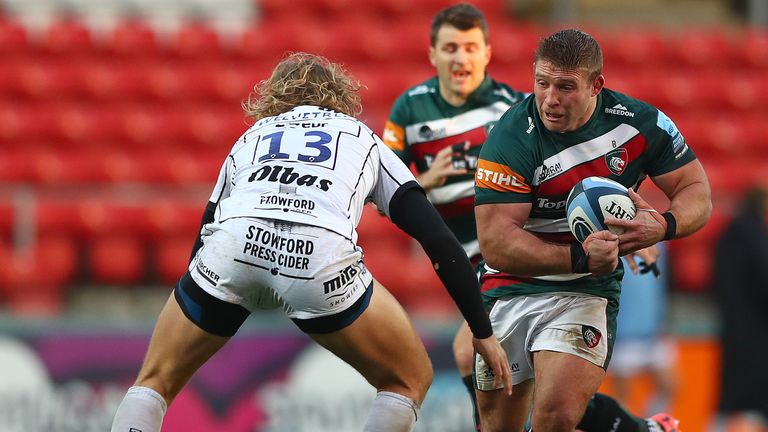 Tom Youngs looks to beat the tackle from Billy Twelvetrees