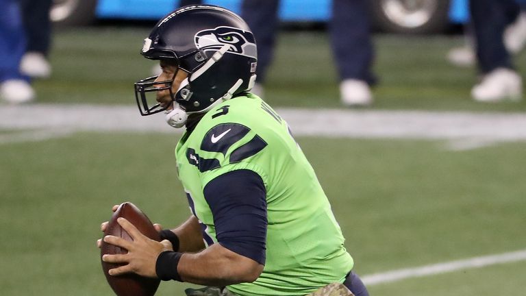 Russell Wilson of the Seattle Seahawks scrambles with the ball against the Arizona Cardinals