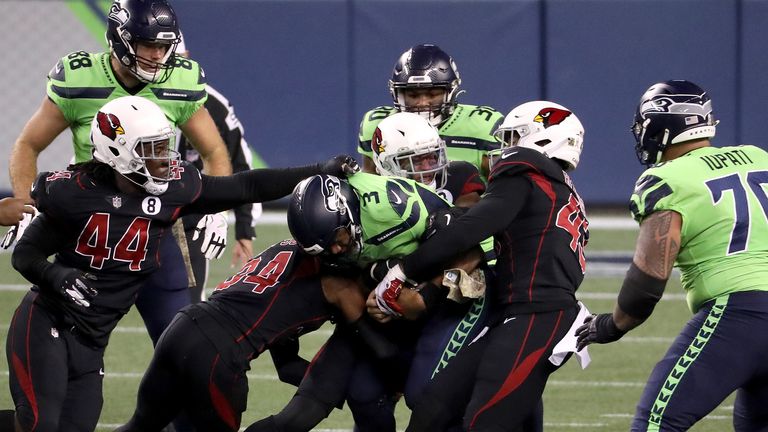 Russell Wilson of the Seattle Seahawks is sacked by the Arizona Cardinals in the first quarter