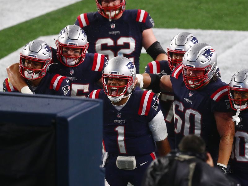 Cam Newton helps Patriots beat Ravens in rain and wind - The San