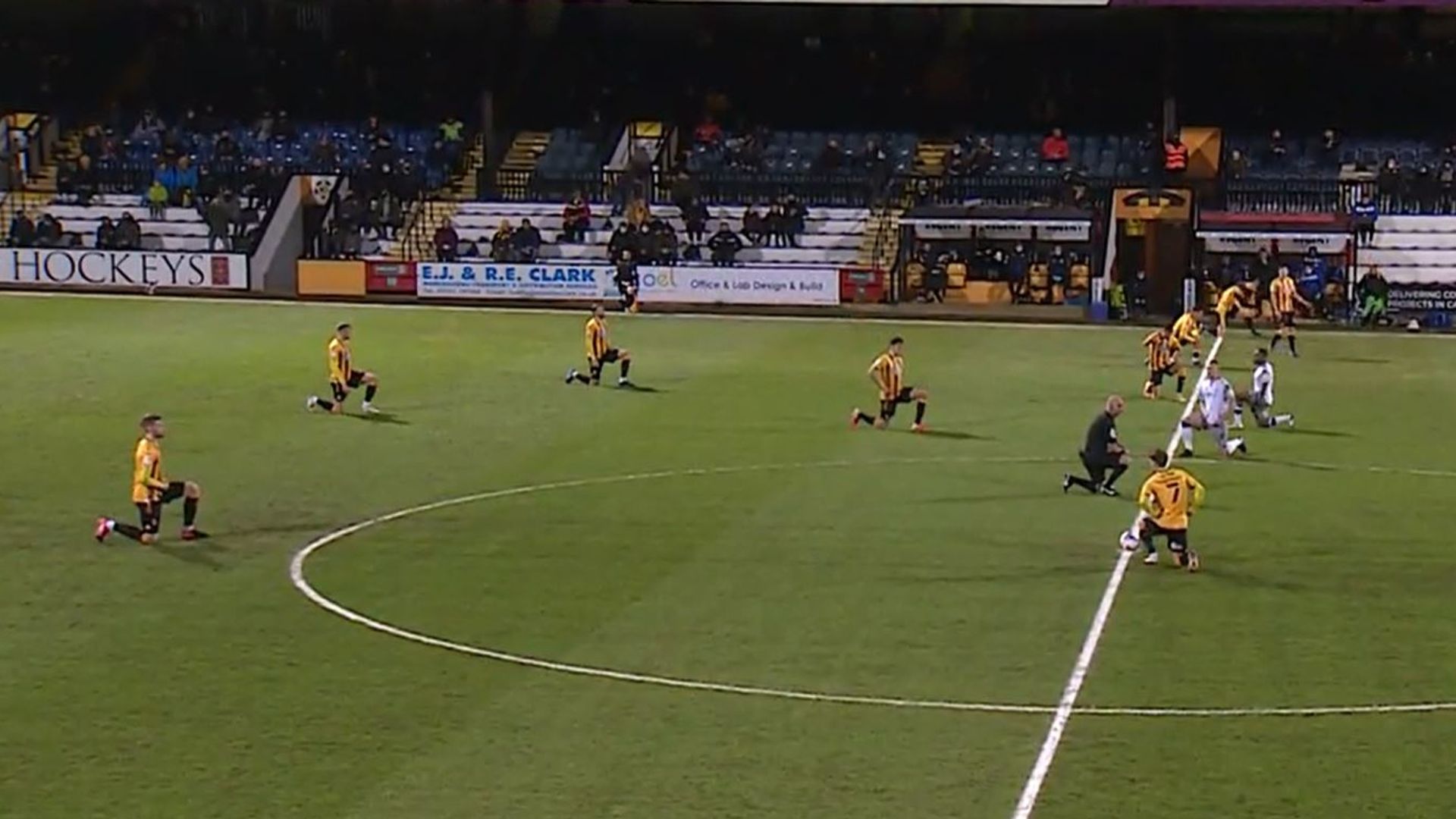Applause drowns out boos as Cambridge and Colchester take knee