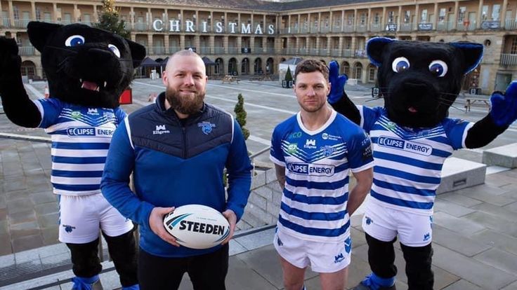 Halifax head coach Simon Grix and player Scott Grix with the club's new panther mascots