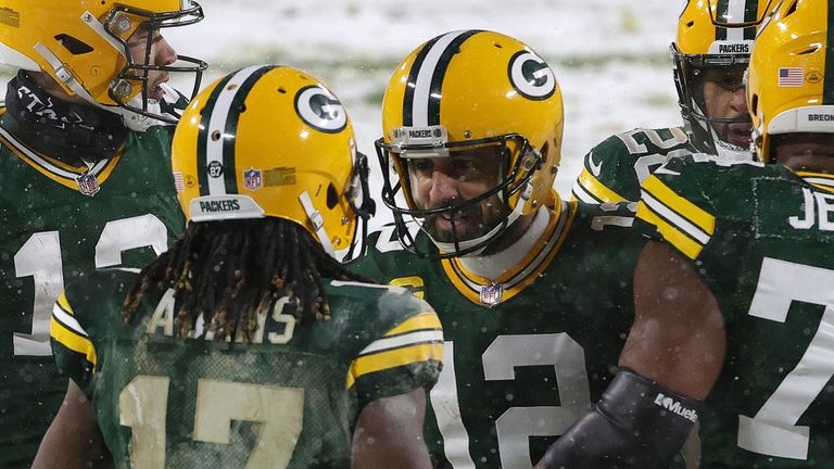 Aaron Rodgers and Davante Adams mark one of their three touchdowns in the Packers' win over the Titans