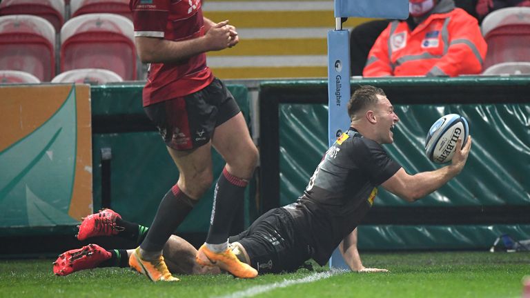 GLOUCESTER, ENGLAND - DECEMBER 06: Quins player Alex Dombrandt crosses to score his try during the Gallagher Premiership Rugby match between Gloucester and Harlequins at Kingsholm Stadium on December 06, 2020 in Gloucester, England. (Photo by Stu Forster/Getty Images)
