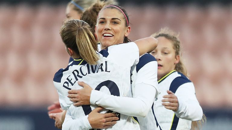 Alex Morgan celebrates after scoring Tottenham's third goal from the penalty spot with Ria Percival
