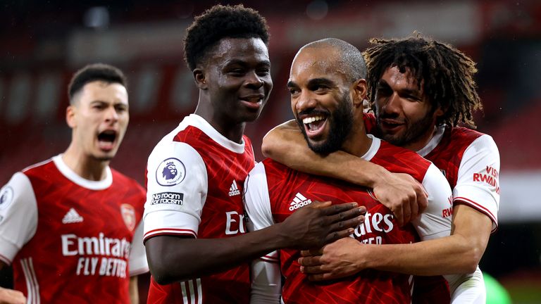 Alexandre Lacazette (centre) celebrates scoring his side's first goal of the game