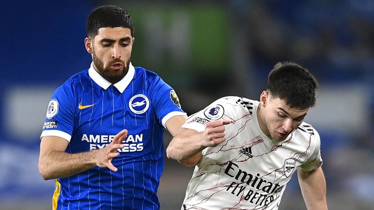 Kieran Tierney of Arsenal is challenged by Alireza Jahanbakhsh of Brighton and Hove Albion during the Premier League match between Brighton & Hove Albion and Arsenal at American Express Community Stadium on December 29, 2020 in Brighton, England. 