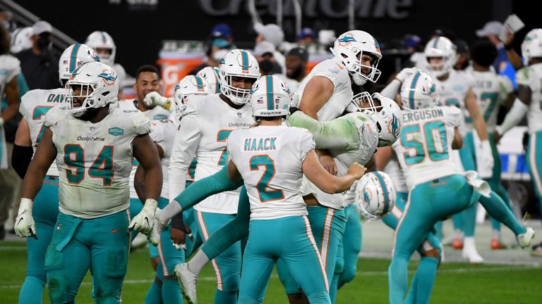 Miami quarterback Ryan Fitzpatrick somehow completed a clutch deep ball while getting facemasked and kicker Jason Sanders then nailed the 44-yard game-winning field goal as the Dolphins edged out the Las Vegas Raiders.