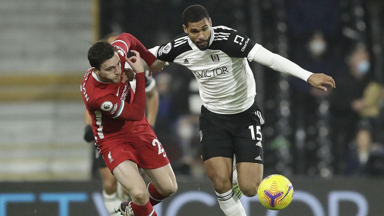 Liverpool's Andrew Robertson (left) and Fulham's Ruben Loftus-Cheek battle for the ball