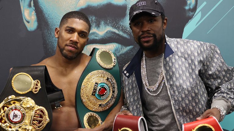 HANDOUT PICTURE COMPLIMENTS OF MATCHROOM BOXING.Anthony Joshua vs Kubrat Pulev, IBF, WBA, WBO & IBO World Title..13 December 2020.Picture By Mark Robinson.Anthony Joshua celebrates his win with Eddie Hearn and Floyd Mayweather Jr in his dressing room. 