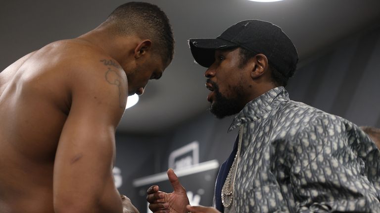 HANDOUT PICTURE COMPLIMENTS OF MATCHROOM BOXING.Anthony Joshua vs Kubrat Pulev, IBF, WBA, WBO & IBO World Title..13 December 2020.Picture By Mark Robinson.Anthony Joshua celebrates his win with Floyd Mayweather Jr in his dressing room. 