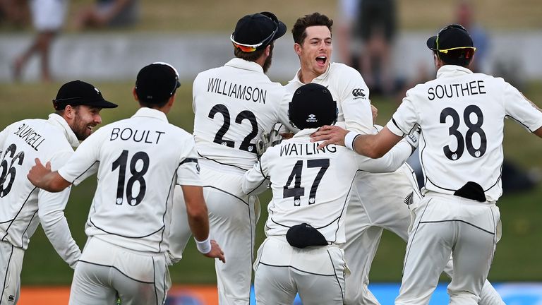 AP Newsroom - New Zealand bowler Mitchell Santner celebrates with his teammates after taking a catch to dismiss Pakistan's Naseem Shah to defeat Pakistan by 101 runs on the final day of the first cricket test at Bay Oval, Mount Maunganui, New Zealand, Wednesday, Dec. 30, 2020. (Andrew Cornaga/Photosport via AP)  