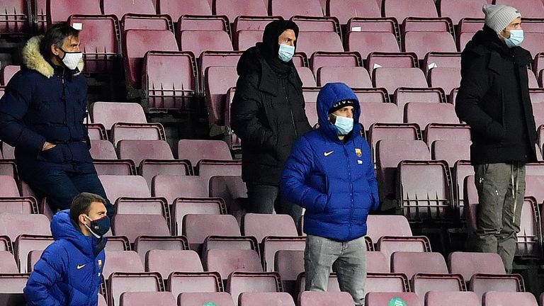 Lionel Messi (back, centre) watched on from the stands as Barcelona were held to a draw