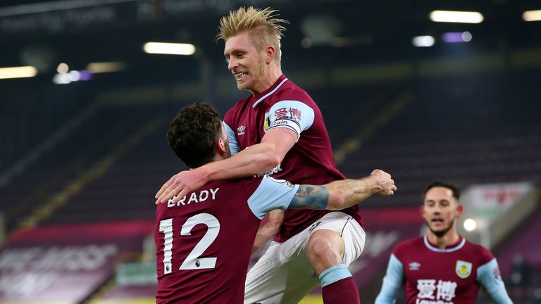Burnley's Ben Mee (centre) celebrates scoring his side's first goal of the game