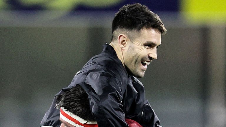 Billy Holland celebrates after the game with Conor Murray.