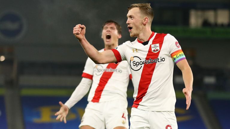 Southampton's English midfielder James Ward-Prowse (R) celebrates after taking a corner where Southampton's Danish defender Jannik Vestergaard (L) scored from a header during the English Premier League football match between Brighton and Hove Albion and Southampton at the American Express Community Stadium in Brighton, southern England on December 7, 2020. 