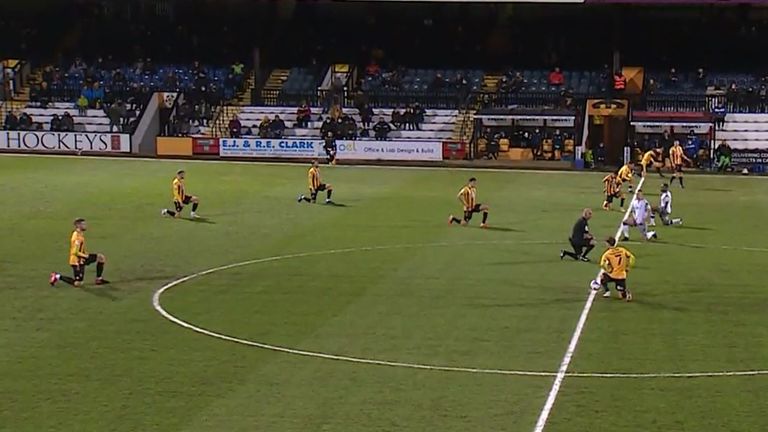 Boos were drowned out by applause at Cambridge as they and Colchester took the knee ahead of their match.