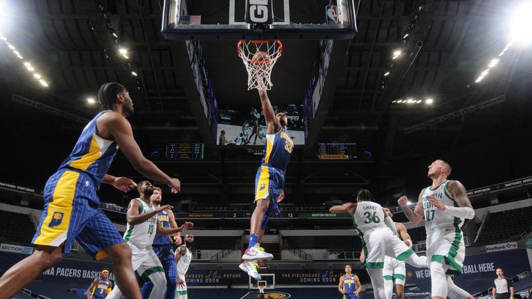  Myles Turner #33 of the Indiana Pacers dunks the ball during the game against the Boston Celtics on December 27, 2020 at Bankers Life Fieldhouse in Indianapolis, Indiana.