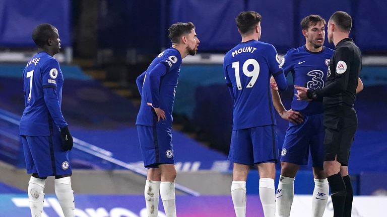 Chelsea players surround Stuart Attwell after Villa's controversial leveller