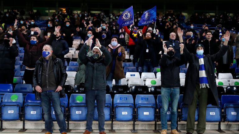 Fans applaud the players of Chelsea as they warm up prior during the Premier League match between Chelsea and Leeds United at Stamford Bridge 
