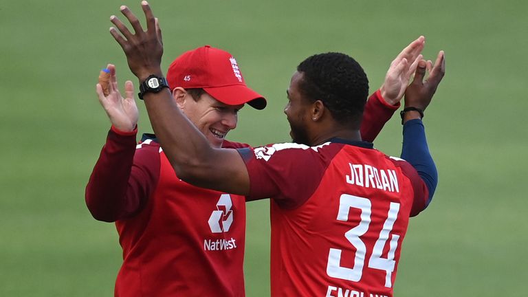 Chris Jordan celebrates with Eoin Morgan after becoming England's leading wicket-taker in T20 cricket
