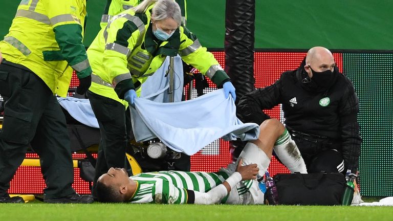 Celtic's Christopher Jullien collides with the goalposts and suffers an injury