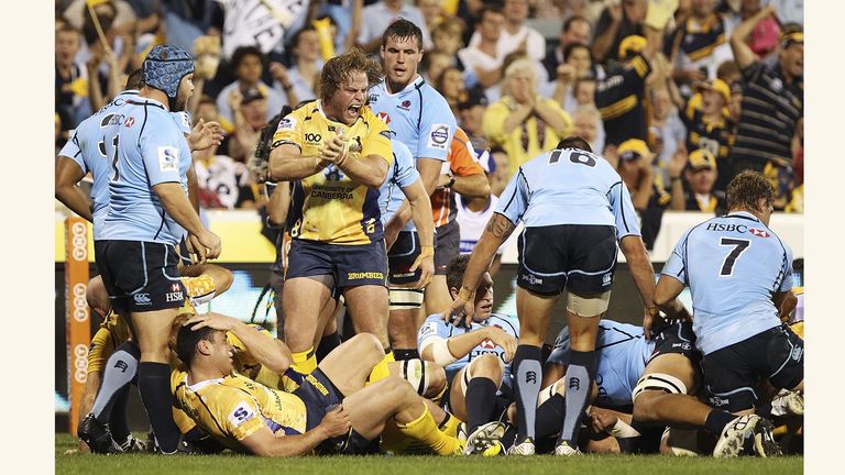 CANBERRA, AUSTRALIA - MARCH 09: Dan Palmer of the Brumbies celebrates a try by Ben Mowen during the round four Super Rugby match between the Brumbies and the Waratahs at Canberra Stadium on March 9, 2013 in Canberra, Australia. (Photo by Stefan Postles/Getty Images)