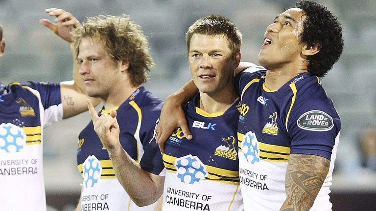 CANBERRA, AUSTRALIA - FEBRUARY 16: Dan Palmer, Clyde Rathbone and Joseph Tomane of the Brumbies celebrate after the round 1 Super Rugby match between the Brumbies and the Reds at Canberra Stadium on February 16, 2013 in Canberra, Australia. (Photo by Stefan Postles/Getty Images)
