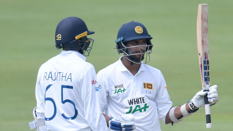 Sri Lanka's Dasun Shanaka raises his bat after scoring his maiden Test 50 at Centurion