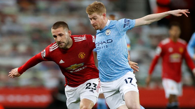 Kevin De Bruyne battles with Luke Shaw