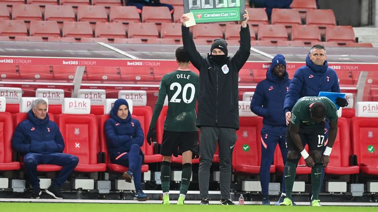 Jose Mourinho watches on as Dele Alli leaves the field