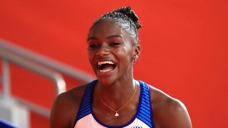 Dina Asher-Smith celebrates after winning the women's 200m final at the IAAF World Championships in 2018