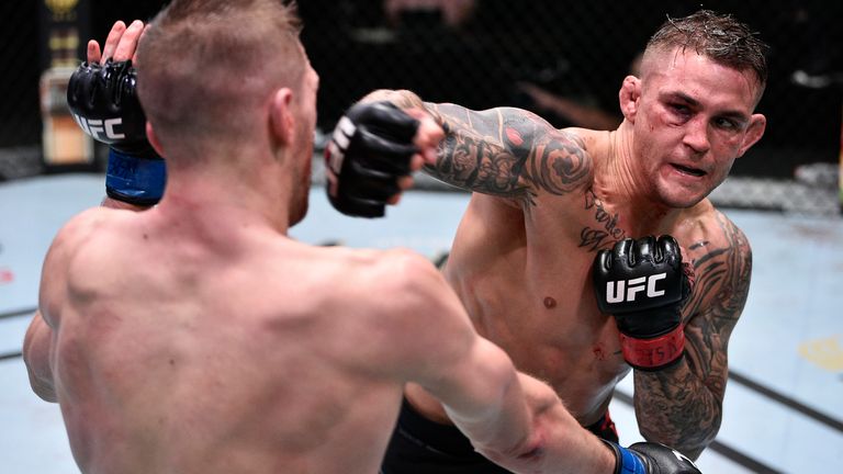In this handout image provided by UFC, (R-L) Dustin Poirier punches Dan Hooker of New Zealand in their lightweight fight during the UFC Fight Night event at UFC APEX on June 27, 2020 in Las Vegas, Nevada. 