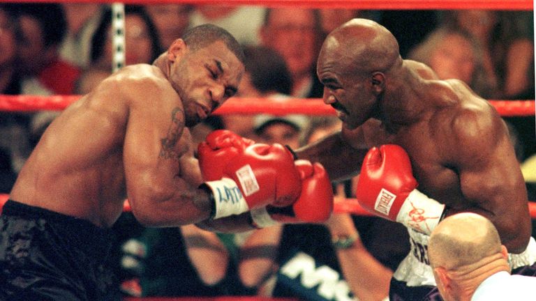 Evander Holyfield stopped Mike Tyson in the 11th round of their first meeting in 1995