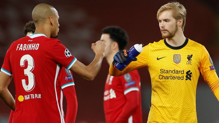 Fabinho fist bumps Caoimhin Kelleher prior to Liverpool's Champions League game versus Ajax