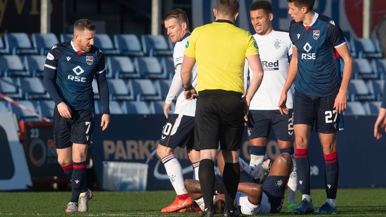 Ross County's Michael Gardyne exchanges words with Alfredo Morelos during the Scottish Premiership match between Ross County and Rangers 