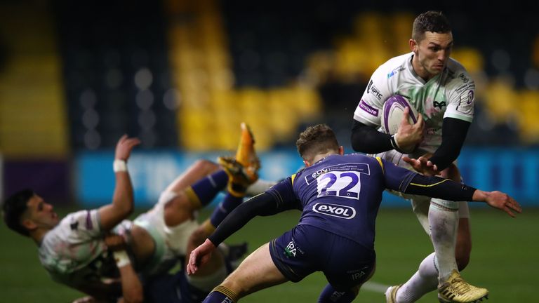 George North of Ospreys charges past the challenge of Billy Searle