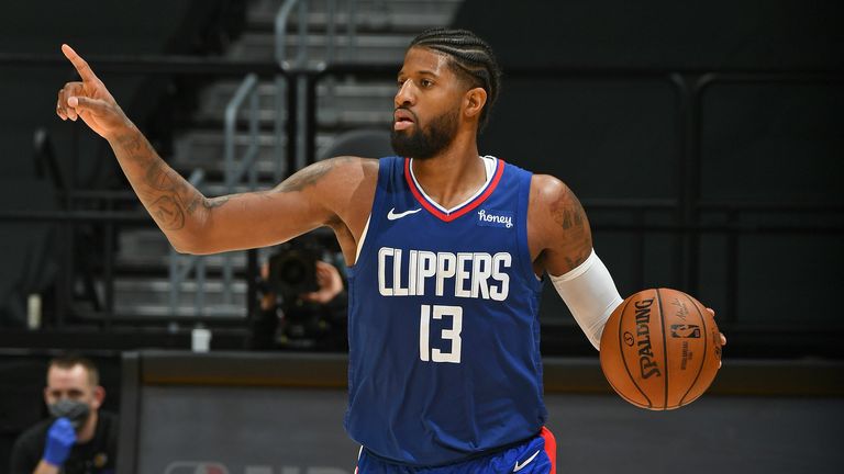 Paul George #13 of the LA Clippers dribbles the ball up court against the Los Angeles Lakers on December 22, 2020