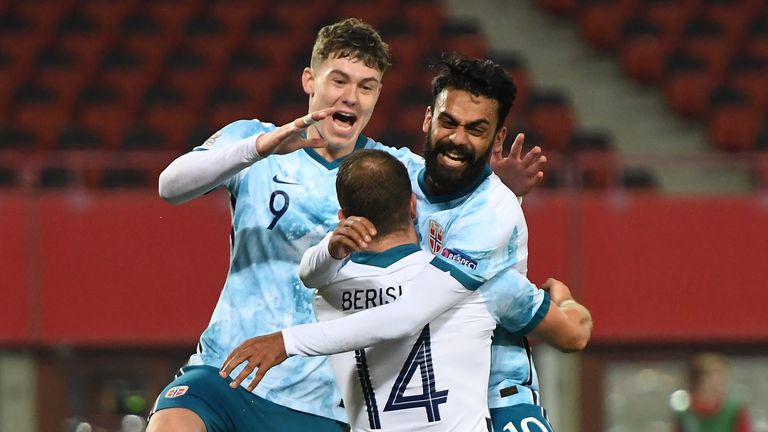 Norway's forward Veton Berisha (C) Norway's midfielder Ghayas Zahid (R) and Norway's forward Jorgen Strand Larsen (L) celebrates scoring the opening goal vie for the ball during the UEFA Nations League football match Austria v Norway on November 18, 2020 in Vienna