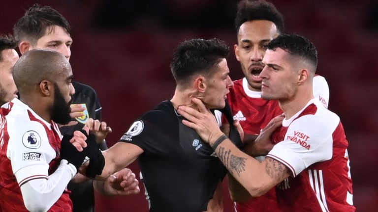 Granit Xhaka appears to grab Ashley Westwood by the throat before his sending off