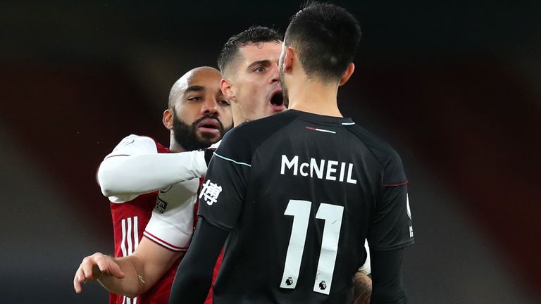 Granit Xhaka squares up to Burnley's Dwight McNeil