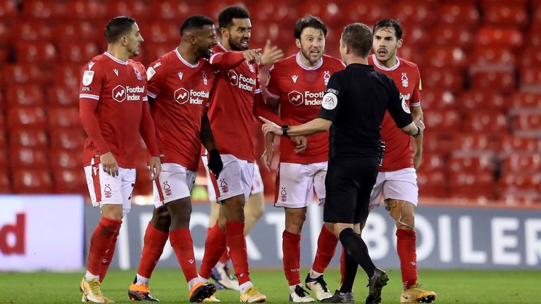 Nottingham Forest players, including Harry Arter who was booked for his protestations, confronted referee David Webb